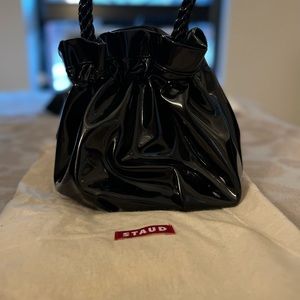 Staud black patent mini bucket bag. Braided handles